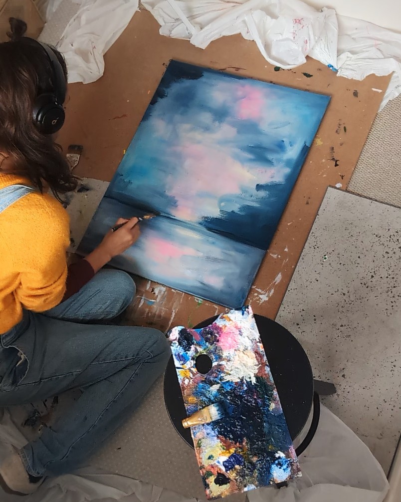Jade Boswell painting in the studio
